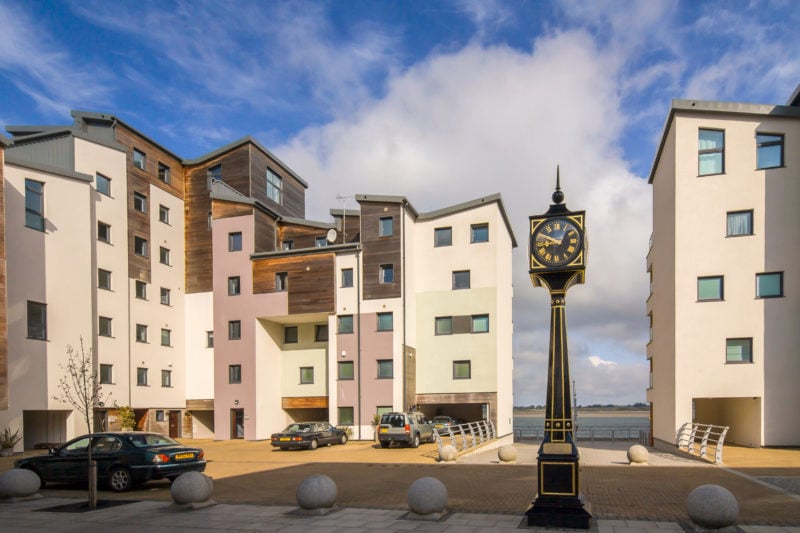 The Caernarfon clock among the resindential houses in the new Victoria dock district