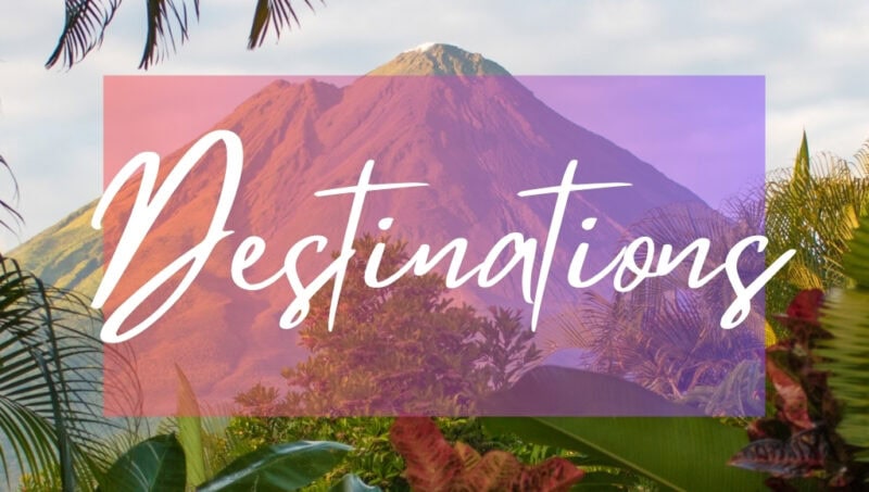 Destinations written in white text over an opaque pink box on top of a photo of a conical mountain framed by lush jungle plants.