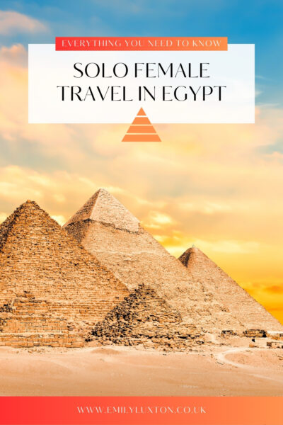 Photo of the 3 Great Pyramids at Giza with empty sandy desert in front and a yellow and gold sunset sky behind. There is a white box with black text on top which reads: Solo Female Travel in Egypt and a smaller red box above that with white text that reads: Everything you Need to Know.  