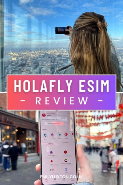 Holafly eSIM review written in white text over a purple box. The top photo shows te back of Emily's head as she takes a photo on a smartphone with a view of London behind on a sunny day. The bottom photo shows a close up of the holafly app in a hand with a street in Chinatown out of focus behind. 